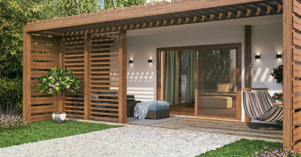 Outdoor view of a cozy in-law suite with wood accents and greenery