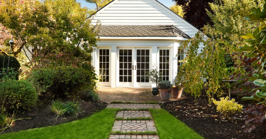 Detached in-law suite with French doors and garden walkway
