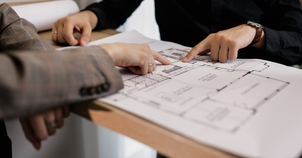 Planning the layout of a new primary suite addition with blueprints