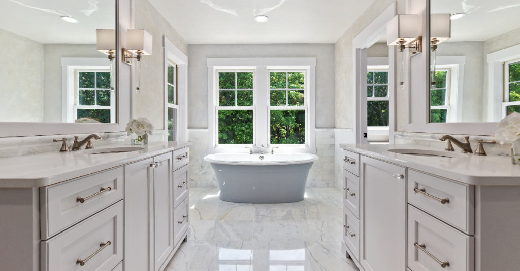 High-end primary suite bath with soaking tub and double vanity