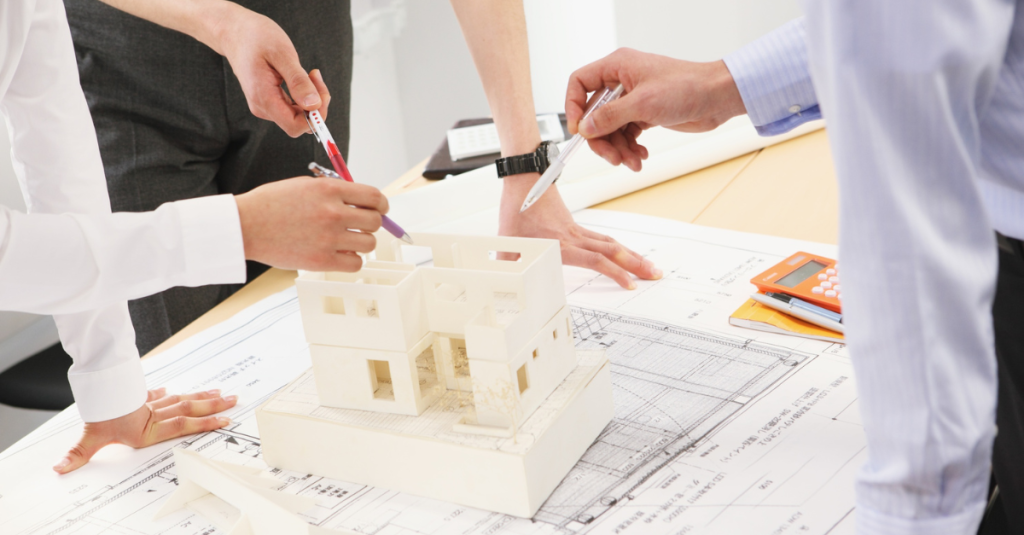 Clients and contractor discussing home model and aging-in-place renovation plans